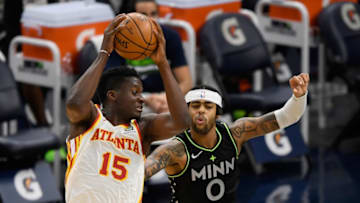 Clint Capela of the Atlanta Hawks catches a pass intended for D'Angelo Russell of the Minnesota Timberwolves. (Photo by Hannah Foslien/Getty Images)