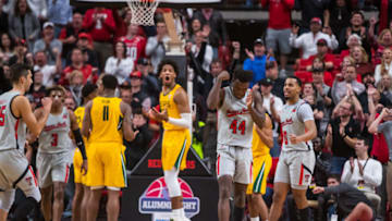 LUBBOCK, TEXAS - JANUARY 07: Guard Chris Clarke #44 of the Texas Tech Red Raiders celebrates after scoring through a foul while forward Freddie Gillespie #33 of the Baylor Bears reacts in the background during the second half of the college basketball game on January 07, 2020 at United Supermarkets Arena in Lubbock, Texas. (Photo by John E. Moore III/Getty Images)
