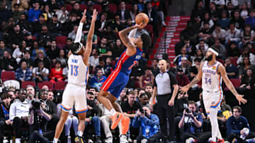 Ousmane Dieng #13 of the Oklahoma City Thunder defends as Killian Hayes #7 of the Detroit Pistons takes a shot (Photo by Minas Panagiotakis/Getty Images)