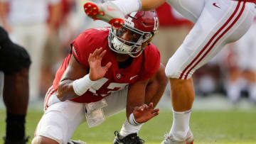 TUSCALOOSA, AL - SEPTEMBER 08: Tua Tagovailoa #13 of the Alabama Crimson Tide holds the ball as Joseph Bulovas #97 kicks an extra point against the Arkansas State Red Wolves at Bryant-Denny Stadium on September 8, 2018 in Tuscaloosa, Alabama. (Photo by Kevin C. Cox/Getty Images)