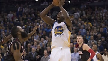 December 1, 2016; Oakland, CA, USA; Golden State Warriors forward Draymond Green (23) shoots the basketball against Houston Rockets guard James Harden (13) during the third quarter at Oracle Arena. The Rockets defeated the Warriors 132-127 in double overtime. Mandatory Credit: Kyle Terada-USA TODAY Sports