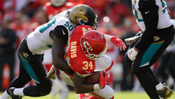 KANSAS CITY, MO - NOVEMBER 6: Kansas City Chiefs running back Knile Davis is tackled by outside linebacker Telvin Smith