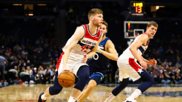Davis Bertans of the Washington Wizards drives to the basket against the Minnesota Timberwolves. (Photo by David Berding/Getty Images)