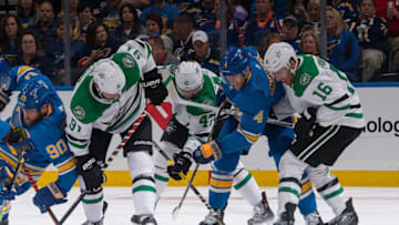 ST. LOUIS, MO - OCTOBER 5: Carl Gunnarsson #4 of the St. Louis Blues battles Tyler Seguin #91 Alexander Radulov #47 and Joe Pavelski #16 of the Dallas Stars for the puck at Enterprise Center on October 5, 2019 in St. Louis, Missouri. (Photo by Scott Rovak/NHLI via Getty Images)