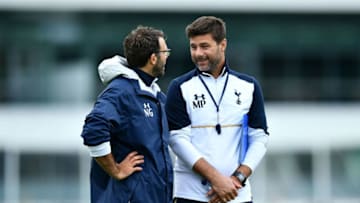 ENFIELD, ENGLAND - JULY 08: Mauricio Pochettino Manager of Tottenham Hotspur (r) talks with Nathan Gardiner, Head of Sports Science, Fitness