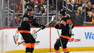 PITTSBURGH, PA - DECEMBER 1: Dale Weise #22 celebrates his goal with Scott Laughton #21 of the Philadelphia Flyers during the third period against the Pittsburgh Penguins at PPG Paints Arena on December 1, 2018 in Pittsburgh, Pennsylvania. (Photo by Joe Sargent/NHLI via Getty Images)
