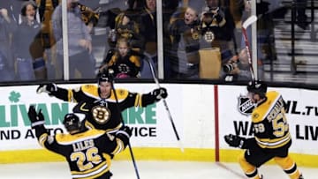 Oct 22, 2016; Boston, MA, USA; Boston Bruins center Dominic Moore (28) reacts with defenseman John-Michael Liles (26) after scoring a goal during the second period against the Montreal Canadiens at TD Garden. Mandatory Credit: Bob DeChiara-USA TODAY Sports