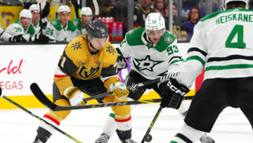 Oct 17, 2023; Las Vegas, Nevada, USA; Dallas Stars center Wyatt Johnston (53) tips the puck away from Vegas Golden Knights center William Karlsson (71) during the first period at T-Mobile Arena. Mandatory Credit: Stephen R. Sylvanie-USA TODAY Sports