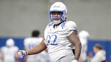 Kansas redshirt sophomore defensive lineman Tommy Dunn Jr. (92) is seen during Tuesday's practice at the Indoor Football Facility.