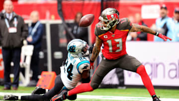 LONDON, ENGLAND - OCTOBER 13: James Bradberry of Carolina Panthers tackles Mike Evans of Tampa Bay Buccaneers during the NFL match between the Carolina Panthers and Tampa Bay Buccaneers at Tottenham Hotspur Stadium on October 13, 2019 in London, England. (Photo by Alex Burstow/Getty Images)