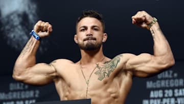 LAS VEGAS, NV - AUGUST 19: Mixed martial artist Mike Perry poses on the scale during his weigh-in for UFC 202 at MGM Grand Conference Center on August 19, 2016 in Las Vegas, Nevada. Perry will meet Hyun Gyu Lim in a welterweight bout on August 20, 2016, at T-Mobile Arena in Las Vegas. (Photo by Ethan Miller/Getty Images)