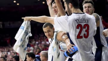 Jan 16, 2016; Tucson, AZ, USA; Arizona Wildcats center Kaleb Tarczewski (35) (top) forward Ryan Anderson (12) (bottom) forward Mark Tollefsen (23) and guard Gabe York (1) (far right) cheer from the bench during the second half against the Washington State Cougars at McKale Center. Arizona won 90-66. Mandatory Credit: Casey Sapio-USA TODAY Sports