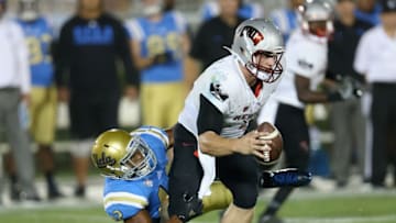 PASADENA, CA - SEPTEMBER 10: Linebacker Kenny Young #42 of the UCLA Bruins sacks quarterback Johnny Stanton #4 of the UNLV Rebels in the third quarter at the Rose Bowl on September 10, 2016 in Pasadena, California. UCLA won 42-21. (Photo by Stephen Dunn/Getty Images)