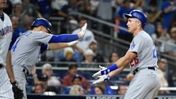 SAN DIEGO, CA - JULY 11: Chase Utley #26 of the Los Angeles Dodgers is congratulated by Enrique Hernandez #14 after scoring during the eighth inning of a baseball game against the San Diego Padres at PETCO Park on July 11, 2018 in San Diego, California. (Photo by Denis Poroy/Getty Images)