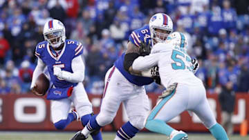 Nov 8, 2015; Orchard Park, NY, USA; Buffalo Bills quarterback Tyrod Taylor (5) runs with the ball as offensive guard Richie Incognito (64) blocks Miami Dolphins outside linebacker Jelani Jenkins (53) during the second half at Ralph Wilson Stadium. The Bills beat the Dolphins 33-17. Mandatory Credit: Kevin Hoffman-USA TODAY Sports