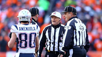 Jan 24, 2016; Denver, CO, USA; NFL referee Ed Hochuli and umpire Richard Hall talk as New England Patriots wide receiver Danny Amendola (80) walks past against the Denver Broncos in the AFC Championship football game at Sports Authority Field at Mile High. Mandatory Credit: Mark J. Rebilas-USA TODAY Sports