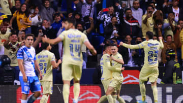 América players rush to celebrate with Álvaro Fidalgo after the Aguilas midfielder scored in minute 90 against Puebla. The club's 2-1 win clinched the No. 1 seed in the Liga MX playoffs. (Photo by Hector Vivas/Getty Images)