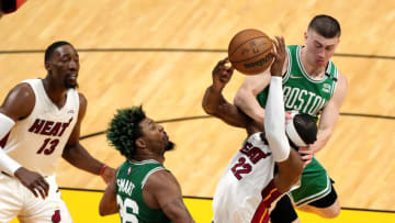 Jimmy Butler #22 of the Miami Heat is fouled by Payton Pritchard #11 of the Boston Celtics(Photo by Eric Espada/Getty Images)
