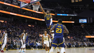 SAN FRANCISCO, CALIFORNIA - MARCH 31: Jonathan Kuminga #00 of the Golden State Warriors dunks against the San Antonio Spurs during the fourth quarter at Chase Center on March 31, 2023 in San Francisco, California. NOTE TO USER: User expressly acknowledges and agrees that, by downloading and or using this photograph, User is consenting to the terms and conditions of the Getty Images License Agreement. (Photo by Thearon W. Henderson/Getty Images)