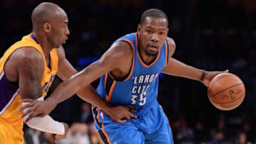 Dec 23, 2015; Los Angeles, CA, USA; Oklahoma City Thunder forward Kevin Durant (35) moves to the basket against Los Angeles Lakers forward Kobe Bryant (24) during the 2nd quarter at Staples Center. Mandatory Credit: Robert Hanashiro-USA TODAY Sports
