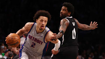 Kyrie Irving #11 of the Brooklyn Nets defends against Cade Cunningham #2 of the Detroit Pistons (Photo by Mike Stobe/Getty Images)