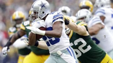 Jan 11, 2015; Green Bay, WI, USA; Dallas Cowboys running back DeMarco Murray (29) is tackled by Green Bay Packers outside linebacker Clay Matthews (52) in the first quarter in the 2014 NFC Divisional playoff football game at Lambeau Field. Mandatory Credit: Jeff Hanisch-USA TODAY Sports