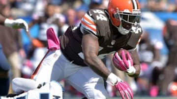 Oct 5, 2014; Nashville, TN, USA; Cleveland Browns running back Ben Tate (44) is tackled by Tennessee Titans cornerback Jason McCourty (30) during the first half at LP Field. Mandatory Credit: Don McPeak-USA TODAY Sports