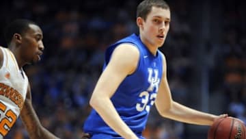 Mar 16, 2013; Knoxville, TN, USA; Kentucky Wildcats forward Kyle Wiltjer (33) brings the ball up court against Tennessee Volunteers guard Jordan McRae (52) during the first half at Thompson-Boling Arena. Mandatory Credit: Randy Sartin-USA TODAY Sports