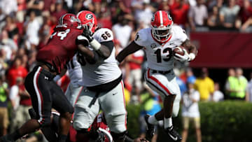 Elijah Holyfield #13 of the Georgia football Bulldogs runs with the ball against the South Carolina Gamecocks during their game at Williams-Brice Stadium on September 8, 2018 in Columbia, South Carolina. (Photo by Streeter Lecka/Getty Images)