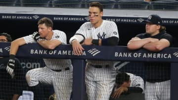 Jun 4, 2021; Bronx, New York, USA; New York Yankees first baseman DJ LeMahieu (26) and right fielder Aaron Judge (99) and injured first baseman Luke Voit (59) look on from the dugout during the ninth inning against the Boston Red Sox at Yankee Stadium. Mandatory Credit: Brad Penner-USA TODAY Sports