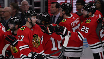 Oct 23, 2022; Chicago, Illinois, USA; Chicago Blackhawks forward Jason Dickinson (17) celebrates his third period goal against the Seattle Kraken at United Center. Chicago defeated Seattle 5-4. Mandatory Credit: Jamie Sabau-USA TODAY Sports