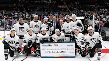 SAN JOSE, CA - JANUARY 26: The Metropolitan Division All-Stars players pose with their one million dollar check after winning the 2019 Honda NHL All-Star Game at SAP Center on January 26, 2019 in San Jose, California. (Photo by Brian Babineau/NHLI via Getty Images)