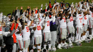 Ohio State Buckeyes players sing “Carmen Ohio” with fans following their 38-25 victory against Penn State Nittany Lions in a NCAA football game at Beaver Stadium in University Park, Pa. on Saturday, Oct. 31, 2020.Ohio State Faces Penn State In Happy Valley