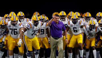 ATLANTA, GEORGIA - DECEMBER 28: Head coach Ed Orgeron of the LSU Tigers and team run onto the to take on the Oklahoma Sooners in the Chick-fil-A Peach Bowl at Mercedes-Benz Stadium on December 28, 2019 in Atlanta, Georgia. (Photo by Kevin C. Cox/Getty Images)