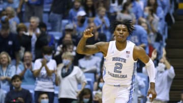 CHAPEL HILL, NORTH CAROLINA - DECEMBER 11: Caleb Love #2 of the North Carolina Tar Heels reacts after a dunk against the Elon Phoenix during the first half of their game at the Dean E. Smith Center on December 11, 2021 in Chapel Hill, North Carolina. (Photo by Grant Halverson/Getty Images)