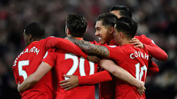 LIVERPOOL, ENGLAND - MARCH 04: Roberto Firmino of Liverpool (R) celebrates scoring his sides first goal with his Liverpool team mates during the Premier League match between Liverpool and Arsenal at Anfield on March 4, 2017 in Liverpool, England. (Photo by Laurence Griffiths/Getty Images)
