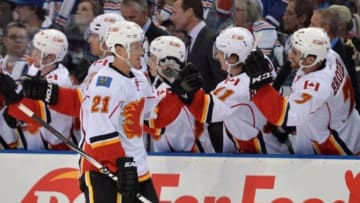 Oct 9, 2014; Edmonton, Alberta, CAN; Calgary Flames left wing Mason Raymond (21) celebrates his goal with teammates against the Edmonton Oilers in the third period at Rexall Place. Calgary won 4-2 over Edmonton. Mandatory Credit: Chris LaFrance-USA TODAY Sports