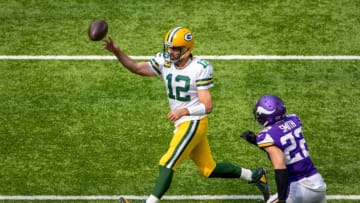 Sep 13, 2020; Minneapolis, Minnesota, USA Green Bay Packers quarterback Aaron Rodgers (12) drops back for a pass as Minnesota Vikings free safety Harrison Smith (22) rushes towards him in the first half at U.S. Bank Stadium. Mandatory Credit: Jesse Johnson-USA TODAY Sports