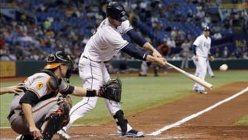 Sep 23, 2013; St. Petersburg, FL, USA; Tampa Bay Rays right fielder Wil Myers (9) hits a 2-RBI single during the seventh inning against the Baltimore Orioles at Tropicana Field. Mandatory Credit: Kim Klement-USA TODAY Sports