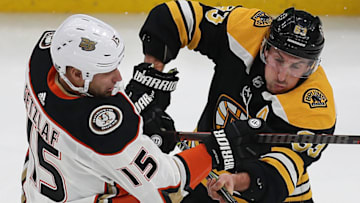 BOSTON - DECEMBER 20: Boston Bruins' Brad Marchand collides with the Ducks' Ryan Getzlaf in the second period. The Boston Bruins host the Anaheim Ducks in a regular season NHL hockey game at TD Garden in Boston on Dec. 20, 2018. (Photo by John Tlumacki/The Boston Globe via Getty Images)
