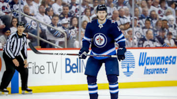 WINNIPEG, MB - APRIL 10: Jacob Trouba #8 of the Winnipeg Jets keeps an eye on the play during second period action against the St. Louis Blues in Game One of the Western Conference First Round during the 2019 NHL Stanley Cup Playoffs at the Bell MTS Place on April 10, 2019 in Winnipeg, Manitoba, Canada. (Photo by Darcy Finley/NHLI via Getty Images)