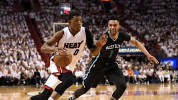 May 1, 2016; Miami, FL, USA; Miami Heat guard Josh Richardson (0) drives past Charlotte Hornets guard Courtney Lee (1) to the basket during the second half in game seven of the first round of the NBA Playoffs at American Airlines Arena. The Heat won 106-73. Mandatory Credit: Steve Mitchell-USA TODAY Sports