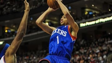 Jan 11, 2014; Philadelphia, PA, USA; Philadelphia 76ers point guard Michael Carter-Williams (1) takes a shot during the game against the New York Knicks at the Wells Fargo Center. The New York Knicks won 102-92.Mandatory Credit: John Geliebter-USA TODAY Sports