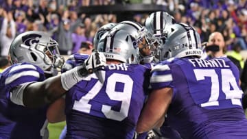MANHATTAN, KS - NOVEMBER 25: Wide receiver Isaiah Zuber (C) of the Kansas State Wildcats celebrates with his teammates after catching the winning touchdown pass against the Iowa State Cyclones on the final play of the game on November 25, 2017 at Bill Snyder Family Stadium in Manhattan, Kansas. (Photo by Peter G. Aiken/Getty Images)