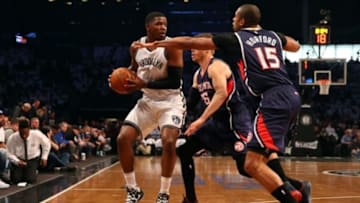 Apr 27, 2015; Brooklyn, NY, USA; Atlanta Hawks guard Kyle Korver (26) and center Al Horford (15) defend Brooklyn Nets forward Joe Johnson (7) during the first quarter in game four of the first round of the NBA Playoffs. at Barclays Center. Mandatory Credit: Anthony Gruppuso-USA TODAY Sports