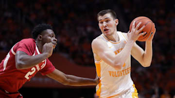 KNOXVILLE, TN - JANUARY 15: John Fulkerson #10 of the Tennessee Volunteers drives past Adrio Bailey #2 of the Arkansas Razorbacks during their game at Thompson-Boling Arena on January 15, 2019 in Knoxville, Tennessee. (Photo by Donald Page/Getty Images)