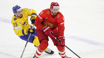 COPENHAGEN, DENMARK - MAY 15, 2018: Sweden's Viktor Arvidsson (L) and Russia's Vladislav Gavrikov fight for the puck in their 2018 IIHF World Championship Preliminary Round Group A ice hockey match at Royal Arena. Anton Novoderezhkin/TASS (Photo by Anton NovoderezhkinTASS via Getty Images)