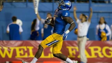 Sep 26, 2015; San Jose, CA, USA; San Jose State Spartans running back Tyler Ervin (7) scores a touchdown against the Fresno State Bulldogs during the third quarter at Spartan Stadium. Mandatory Credit: Kelley L Cox-USA TODAY Sports