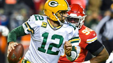Green Bay Packers quarterback Aaron Rodgers (12) is chased out of the pocket in the second quarter by Kansas City Chiefs defensive end Emmanuel Ogbah at Arrowhead Stadium in Kansas City, Mo., on Sunday, Oct. 27, 2019. (Rich Sugg/Kansas City Star/Tribune News Service via Getty Images)
