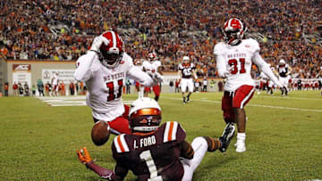 Oct 9, 2015; Blacksburg, VA, USA; Virginia Tech Hokies wide receiver Isaiah Ford (1) drops a pass in the end zone against North Carolina State Wolfpack cornerback Juston Burris (11) during the second quarter at Lane Stadium. Mandatory Credit: Peter Casey-USA TODAY Sports